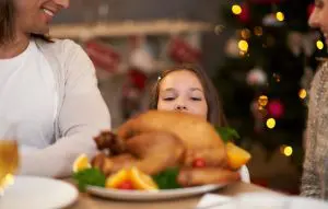 pic og girl looking at a cooked turkey classic christmas recipes christmas.co.uk