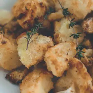 Pic of crunchy roast potatoes - vegan side dishes to enjoy on Christmas Day christmas.co.uk