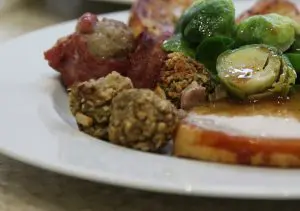 pic of Christmas stuffing balls on a festive dinner plate - Christmas stuffing – the history and recipes to impress diners