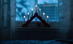 pic of a Christmas candle bridge in a window - festive scene