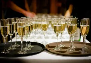 Pic of trays of champagne glasses to illustrate an article about Christmas hangover cures