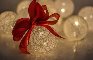 Pic of baubles and red ribbon to illustrate an article about timeless decorations for Christmas